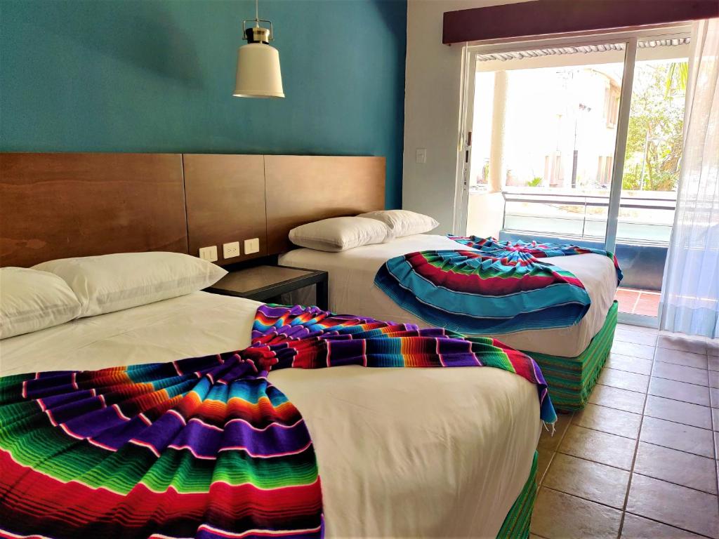 https://www.booking.com/hotel/mx/plaza-mariachi.es.html?